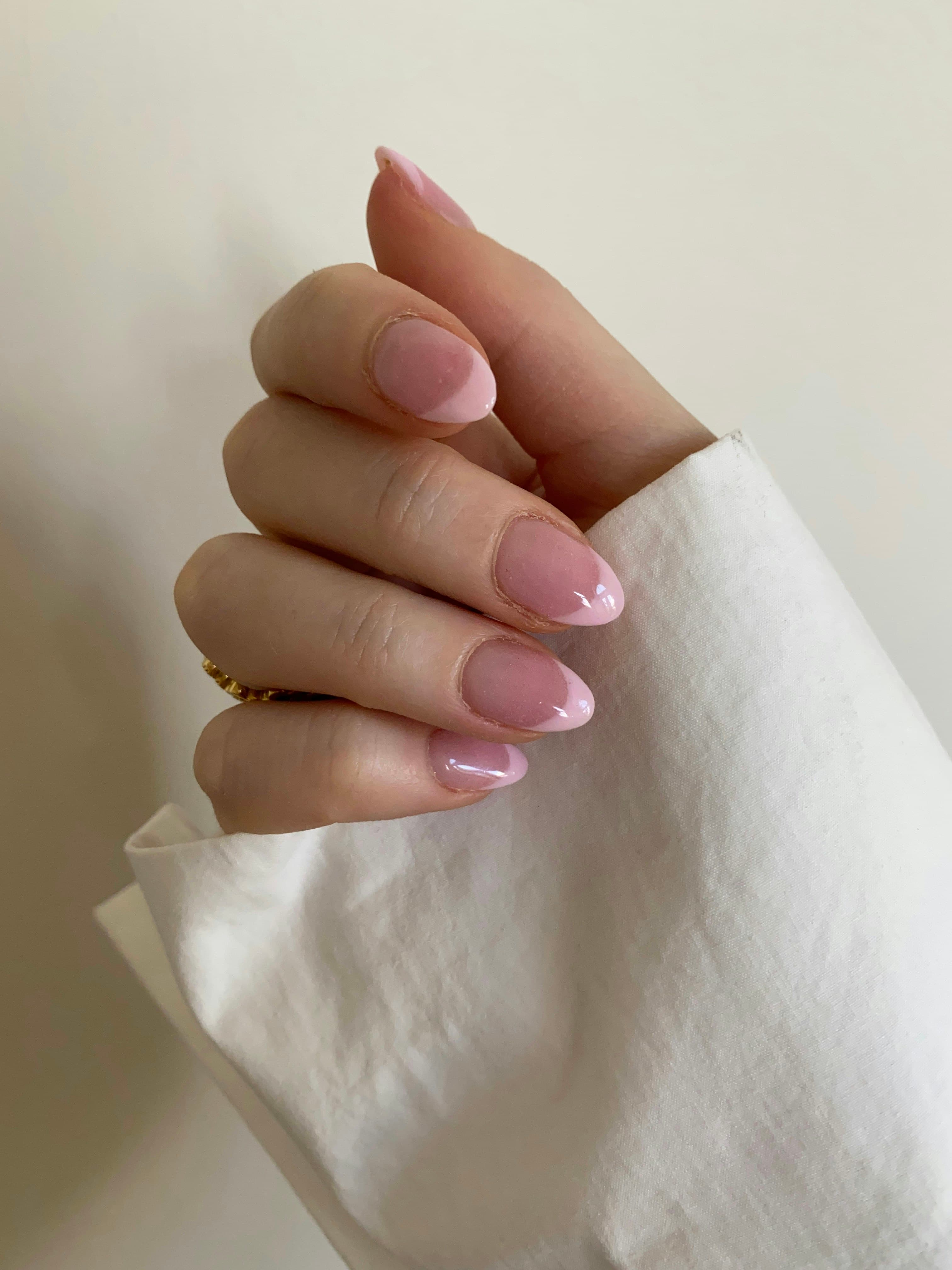 Hand with a clean, softly polished manicure