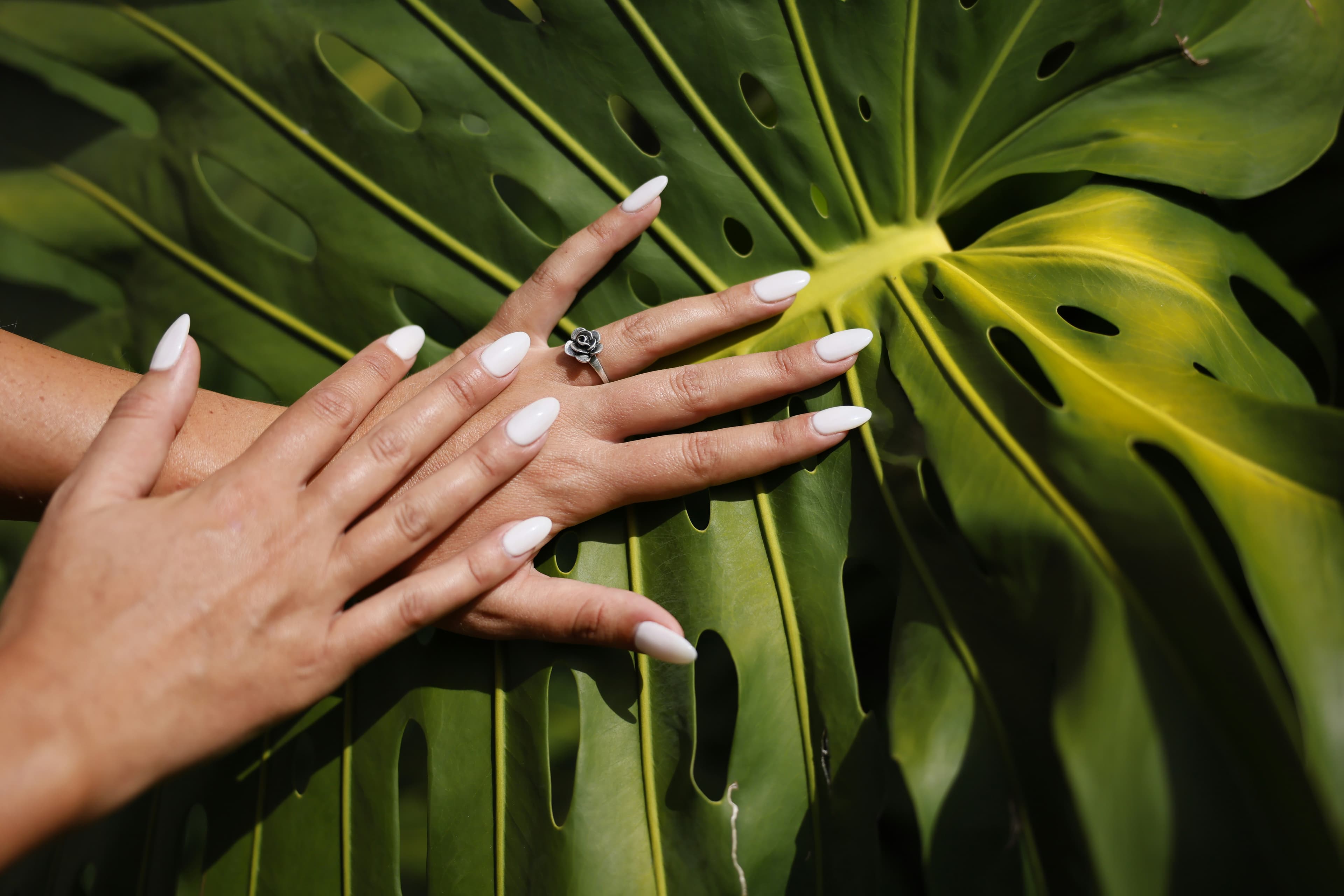 Longer milky white set photographed with a ring